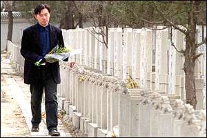 Man visiting grave